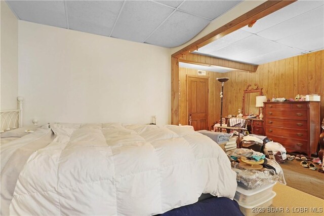 333 Crane Cove Rd, Sunrise Beach, MO 65079 - bedroom featuring wood finished floors, wood walls, and a drop ceiling