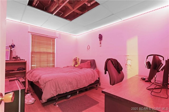 333 Crane Cove Rd, Sunrise Beach, MO 65079 - bedroom with wood finished floors and a drop ceiling