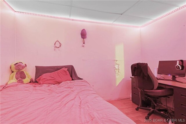 333 Crane Cove Rd, Sunrise Beach, MO 65079 - bedroom with wood finished floors, an office area, and a drop ceiling