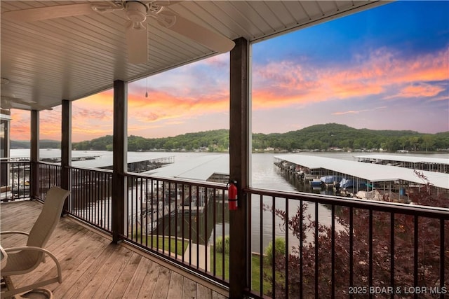 686 Clearwater Dr Unit 2C, Camdenton, MO 65020 - deck at dusk featuring a water view
