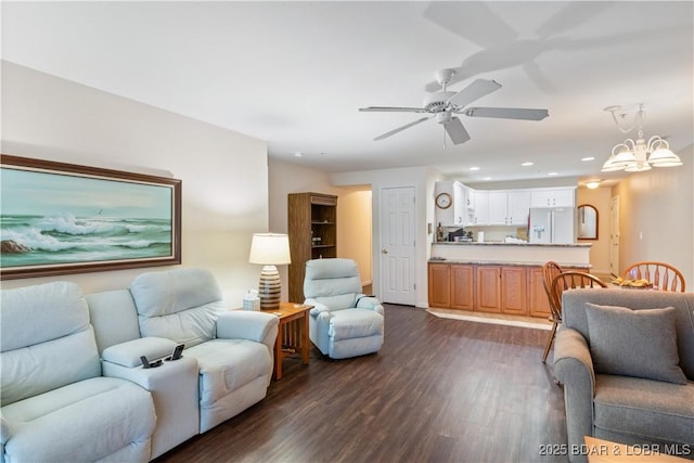 686 Clearwater Dr Unit 2C, Camdenton, MO 65020 - living room with dark wood-style flooring, a ceiling fan, recessed lighting, and a chandelier