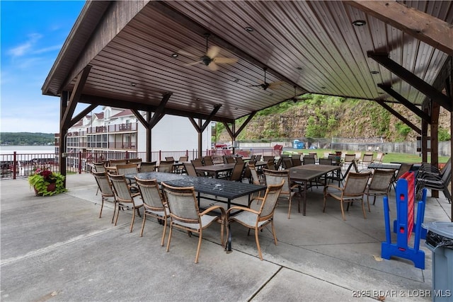 686 Clearwater Dr Unit 2C, Camdenton, MO 65020 - view of patio / terrace with a ceiling fan, a water view, and outdoor dining space