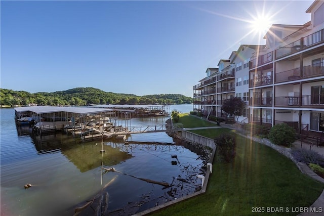 686 Clearwater Dr Unit 2C, Camdenton, MO 65020 - dock area with a water view and a lawn