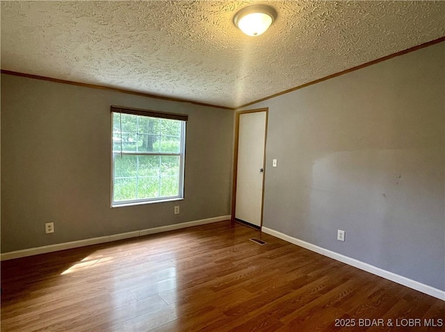 4712 Camden Line Rd, Lebanon, MO 65536 - spare room with crown molding, a textured ceiling, and wood finished floors