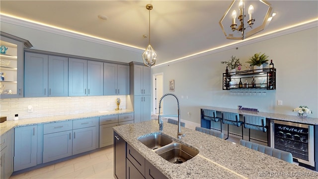 1065 Topsider Ln Unit 505, Osage Beach, MO 65065 - kitchen with wine cooler, backsplash, light stone countertops, ornamental molding, and a chandelier