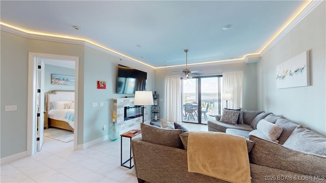 1065 Topsider Ln Unit 505, Osage Beach, MO 65065 - living room featuring ornamental molding, a glass covered fireplace, and ceiling fan
