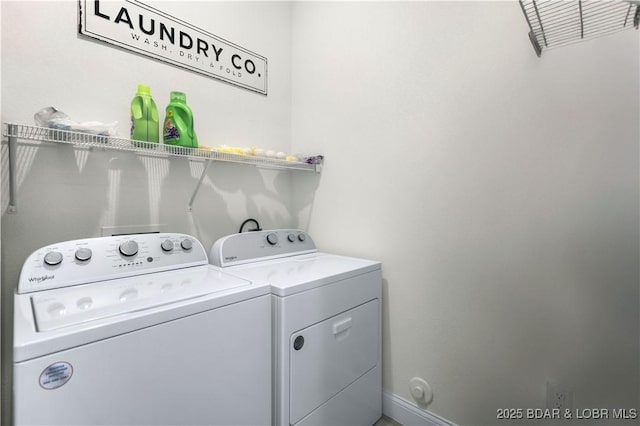 1065 Topsider Ln Unit 505, Osage Beach, MO 65065 - laundry room featuring washing machine and clothes dryer and baseboards