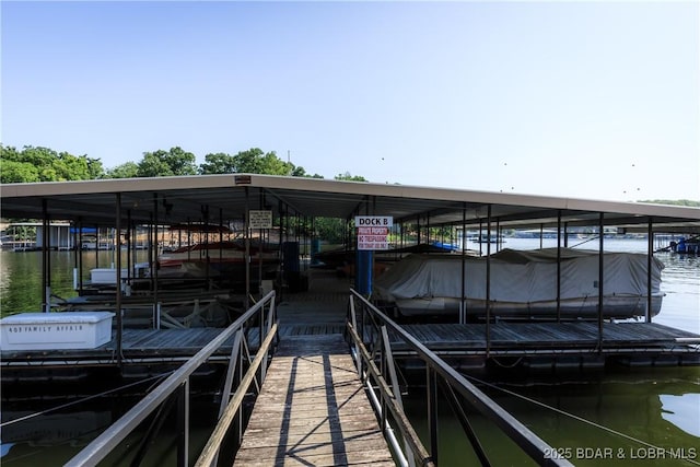 23 Willow Ridge Pt Unit 2B, Lake Ozark, MO 65049 - dock area with boat lift and a water view