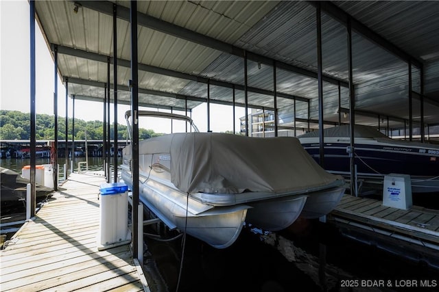 23 Willow Ridge Pt Unit 2B, Lake Ozark, MO 65049 - dock featuring boat lift and a water view