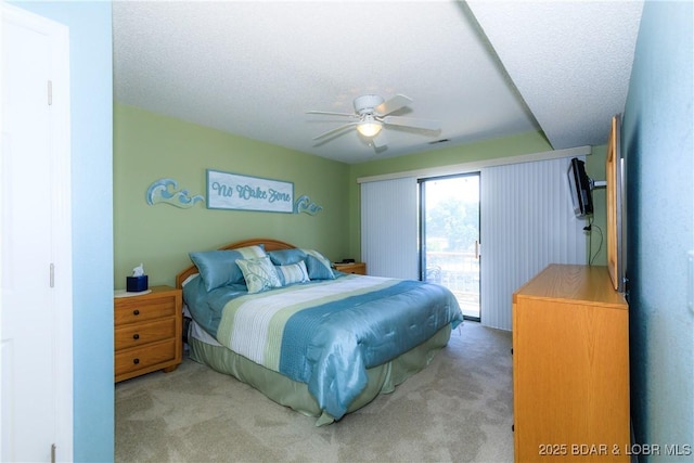 23 Willow Ridge Pt Unit 2B, Lake Ozark, MO 65049 - bedroom with access to outside, carpet flooring, and a ceiling fan