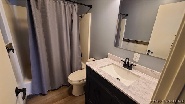 508 Hunter St N, Versailles, MO 65084 - bathroom with vanity, wood finished floors, and shower / bath combo