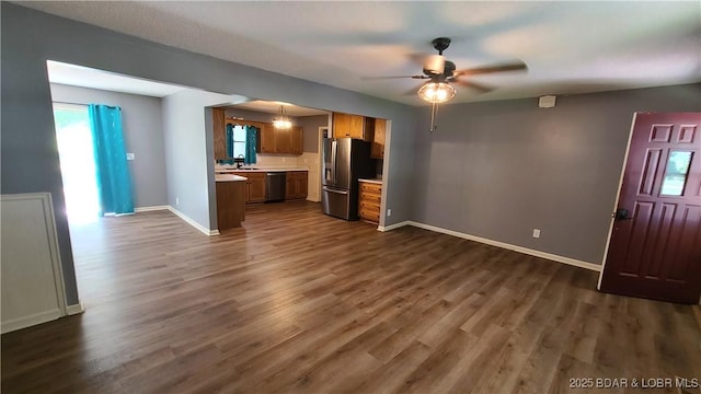 508 Hunter St N, Versailles, MO 65084 - kitchen with stainless steel appliances, ceiling fan, light countertops, and open floor plan