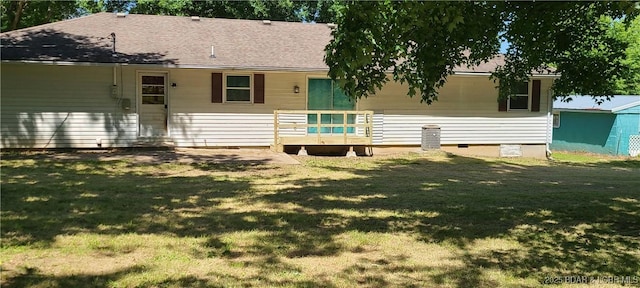 508 Hunter St N, Versailles, MO 65084 - rear view of house with a lawn, a wooden deck, crawl space, and roof with shingles