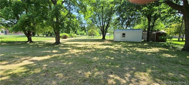 508 Hunter St N, Versailles, MO 65084 - view of yard with a storage shed
