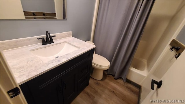 508 Hunter St N, Versailles, MO 65084 - full bathroom with wood finished floors, vanity, and shower / bath combination with curtain
