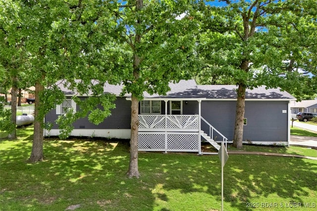 712 Passover Rd, Osage Beach, MO 65065 - view of front facade with a front yard and roof with shingles