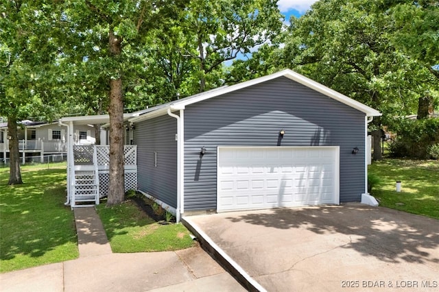 712 Passover Rd, Osage Beach, MO 65065 - view of front of property with a front lawn and a garage