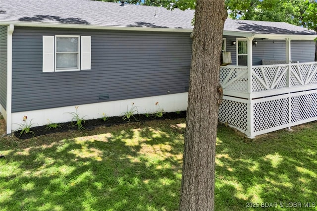 712 Passover Rd, Osage Beach, MO 65065 - view of home's exterior featuring a lawn and a shingled roof