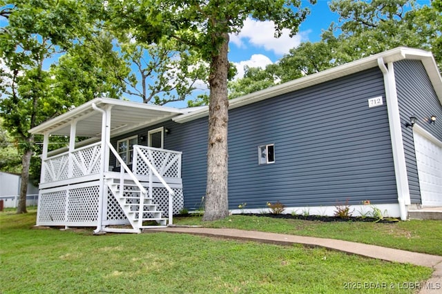 712 Passover Rd, Osage Beach, MO 65065 - back of property featuring a lawn