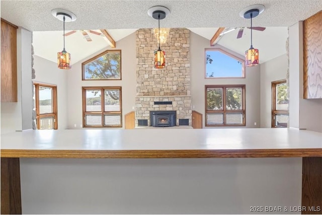 948 Cable Point Dr, Climax Springs, MO 65324 - kitchen featuring vaulted ceiling, a textured ceiling, ceiling fan, and hanging light fixtures