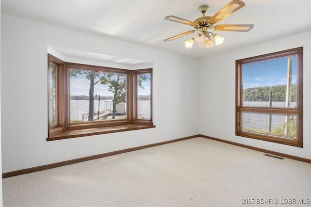 948 Cable Point Dr, Climax Springs, MO 65324 - empty room with light carpet, a ceiling fan, and a water view