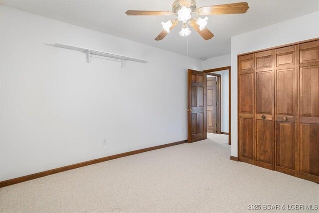 948 Cable Point Dr, Climax Springs, MO 65324 - unfurnished bedroom with light carpet, ceiling fan, and a closet