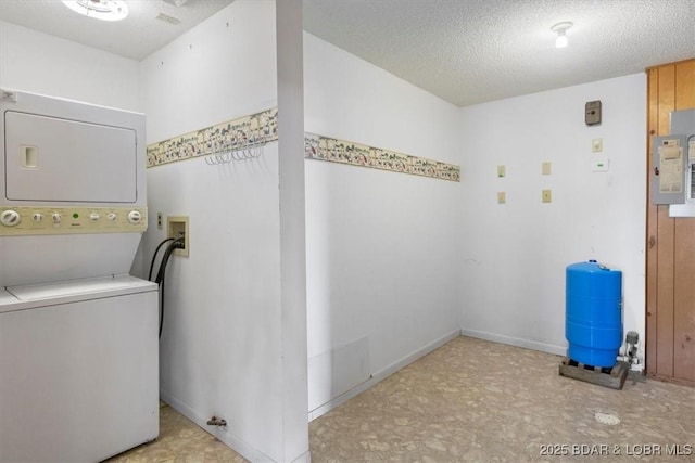 948 Cable Point Dr, Climax Springs, MO 65324 - washroom with stacked washer / dryer, electric panel, and a textured ceiling