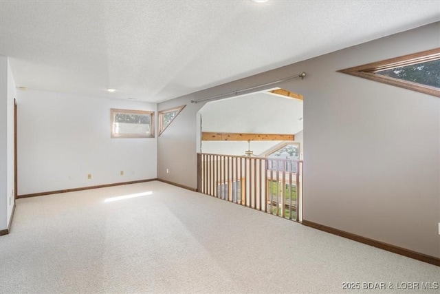 948 Cable Point Dr, Climax Springs, MO 65324 - empty room with plenty of natural light, carpet flooring, and a textured ceiling