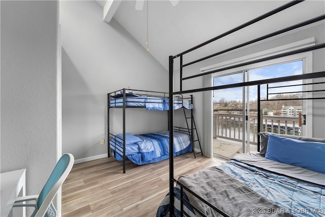 6504 Avalon Park, Osage Beach, MO 65065 - bedroom featuring wood finished floors, high vaulted ceiling, and a water view