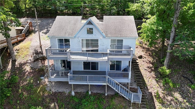 6504 Avalon Park, Osage Beach, MO 65065 - view of front of house with a balcony, stairway, and roof with shingles