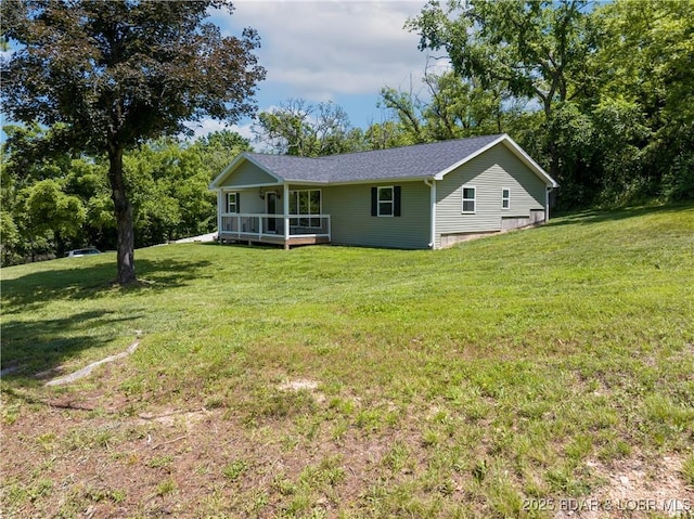 326 State Rd W, Macks Creek, MO 65786 - view of front of home featuring a front yard and roof with shingles
