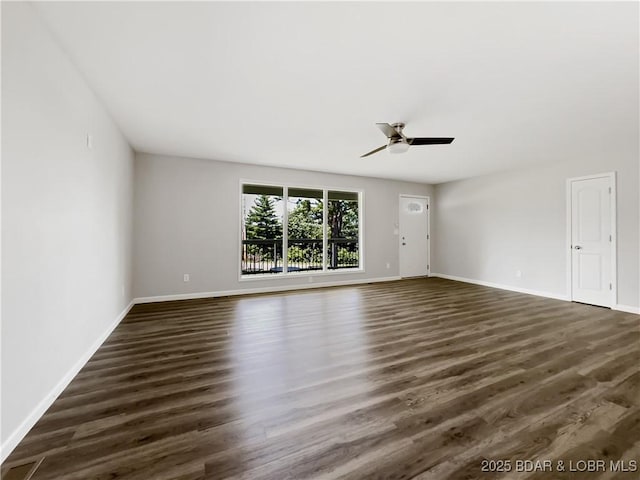 326 State Rd W, Macks Creek, MO 65786 - spare room featuring dark wood finished floors and a ceiling fan