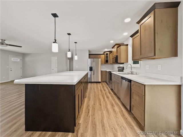 326 State Rd W, Macks Creek, MO 65786 - kitchen featuring stainless steel appliances, light wood-style floors, glass insert cabinets, a kitchen island, and pendant lighting