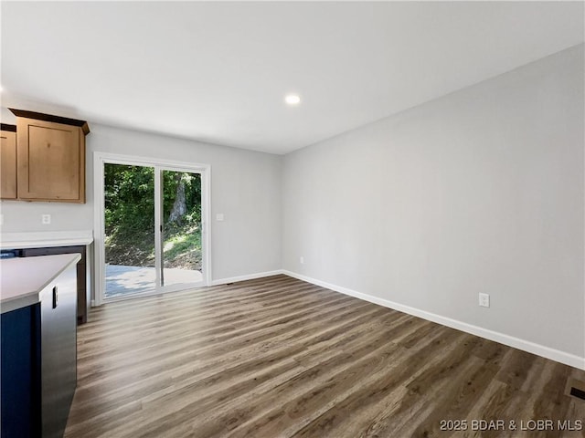 326 State Rd W, Macks Creek, MO 65786 - unfurnished living room with dark wood-style flooring and recessed lighting