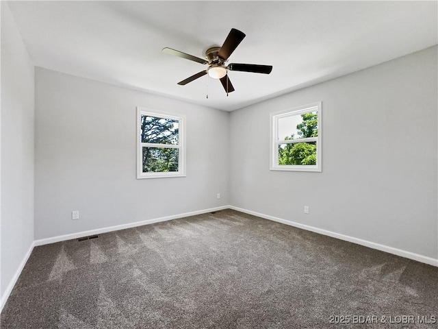326 State Rd W, Macks Creek, MO 65786 - spare room with healthy amount of natural light, carpet flooring, and ceiling fan