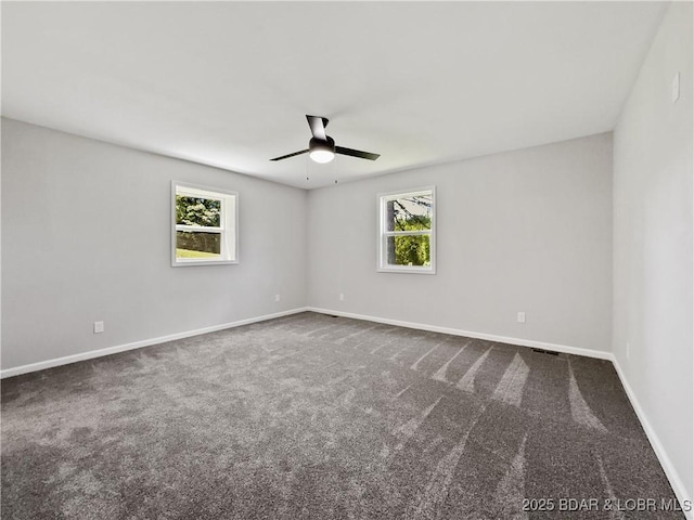 326 State Rd W, Macks Creek, MO 65786 - spare room featuring ceiling fan and dark colored carpet