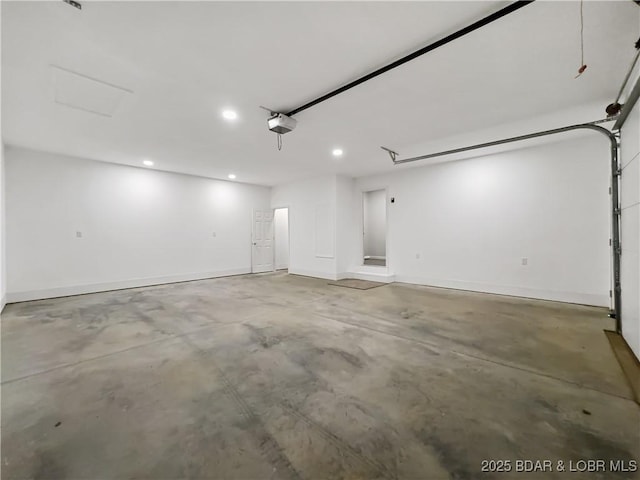 326 State Rd W, Macks Creek, MO 65786 - garage featuring a garage door opener and recessed lighting