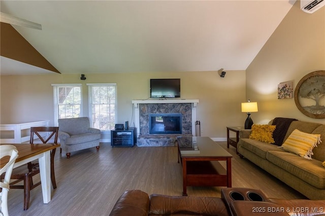 415 Staniel Cay Dr, Osage Beach, MO 65065 - living area featuring lofted ceiling, wood finished floors, and a fireplace