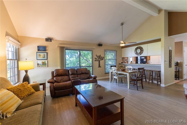 415 Staniel Cay Dr, Osage Beach, MO 65065 - living room featuring beamed ceiling, wood finished floors, healthy amount of natural light, ceiling fan, and high vaulted ceiling