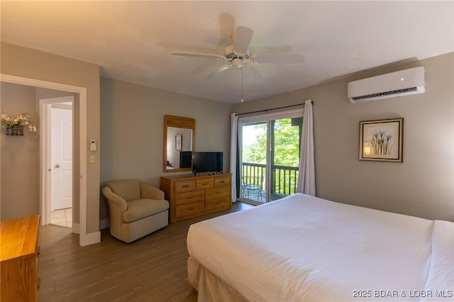 415 Staniel Cay Dr, Osage Beach, MO 65065 - bedroom with a wall mounted AC, access to exterior, wood finished floors, and ceiling fan