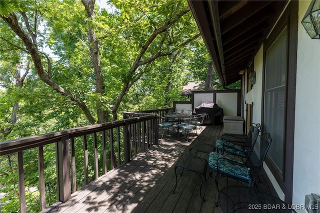 415 Staniel Cay Dr, Osage Beach, MO 65065 - wooden deck with outdoor dining area and a grill