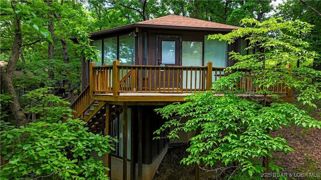 146 Tree Top Dr Unit 8, Four Seasons, MO 65049 - view of outbuilding with stairway and a sunroom