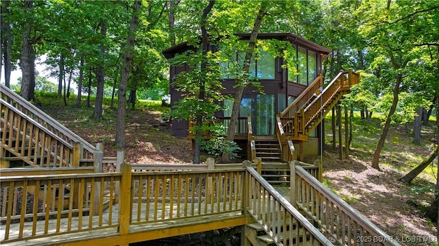 146 Tree Top Dr Unit 8, Four Seasons, MO 65049 - deck with stairs and a sunroom