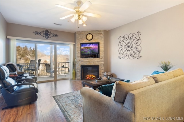 464 Cedar Heights Dr Unit 3G, Camdenton, MO 65020 - living room with ceiling fan, a fireplace, and wood finished floors