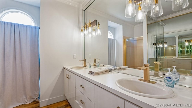 2268 Breezy Acres Rd, Osage Beach, MO 65065 - bathroom featuring healthy amount of natural light, double vanity, a shower with door, ornamental molding, and wood finished floors
