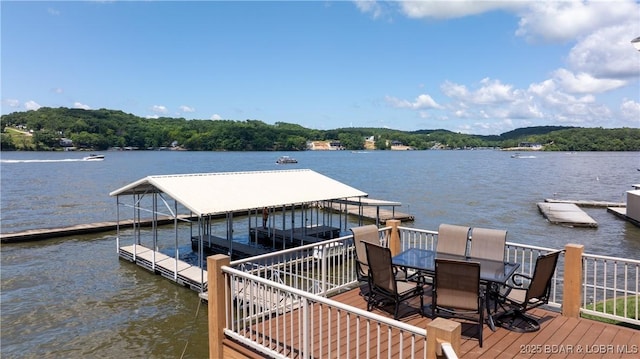 2268 Breezy Acres Rd, Osage Beach, MO 65065 - dock with a water view and outdoor dining space