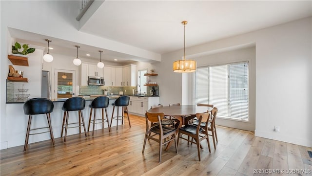 2268 Breezy Acres Rd, Osage Beach, MO 65065 - dining area with light wood finished floors and recessed lighting