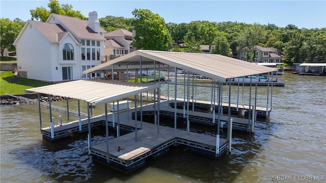 2268 Breezy Acres Rd, Osage Beach, MO 65065 - dock with boat lift and a water view
