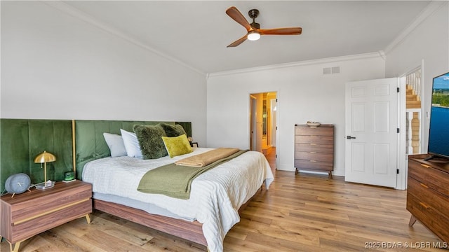 2268 Breezy Acres Rd, Osage Beach, MO 65065 - bedroom with ornamental molding, wood finished floors, and ceiling fan