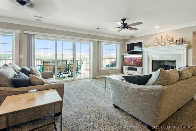 68 Lighthouse Rd Unit 906, Lake Ozark, MO 65049 - carpeted living room featuring a ceiling fan, ornamental molding, a high end fireplace, and recessed lighting
